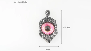 Macro view of vintage silver steel Evil Eye pendant showing dimensions and weight