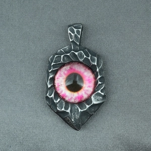 Gothic titanium steel necklace featuring a realistic pink evil eye pendant on grey fabric