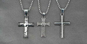 Detailed close-up of three titanium steel cross necklaces with unique textures and box chains
