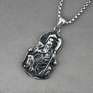 Vintage oxidized stainless steel pendant necklace featuring detailed Guan Gong warrior relief