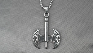 Macro detail of Thor's hammer pendant with relief texture and vintage stainless steel finish