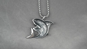 Detailed close-up of retro shark pendant in stainless steel with a sturdy box chain