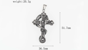 Detailed view showing dragon and skull engraving on gothic cross pendant with dimensions