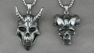 Detailed view of punk skull pendants with cross and ram horns on vintage steel chains