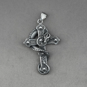 Gothic dragon wrapped around a skull cross pendant in vintage stainless steel finish
