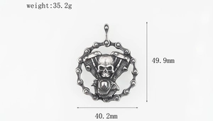 Detailed macro view showing the engine skull pendant dimensions of 49.9mm by 40.2mm