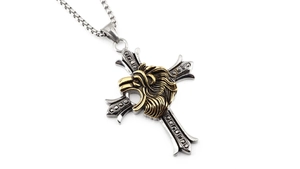 Macro detail of retro lion head on a silver steel cross pendant with black gemstones