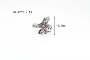 Detail view of dragon ring with red gem eyes and scale texture, 19.4mm height