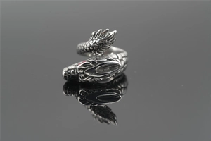 Macro detail of retro dragon ring showing intricate scales and craftsmanship on steel