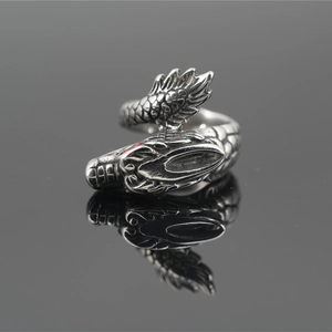 Vintage dragon-shaped punk ring made of oxidized titanium steel with red eye details