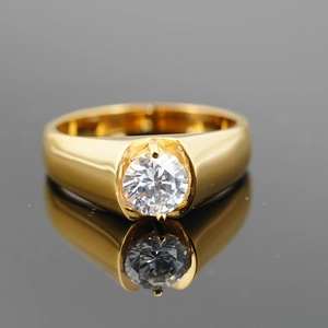 Classic gold titanium wedding ring featuring a round clear zircon on a black surface