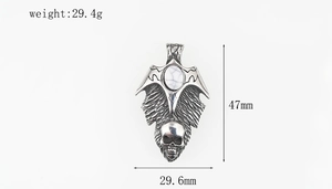 Macro shot of gothic skull pendant with white turquoise stone, size 47mm by 29.6mm