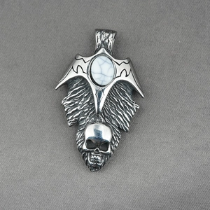 Gothic stainless steel necklace with bat wings, turquoise stone, and skull pendant details