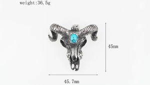 Detailed macro view showing the size dimensions and weight of the turquoise bull skull necklace