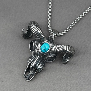 Retro bull skull necklace with turquoise stone in silver finish on a box chain
