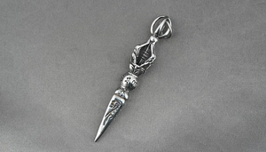 Detailed macro view of the titanium steel Vajra pestle pendant with Buddhist engravings