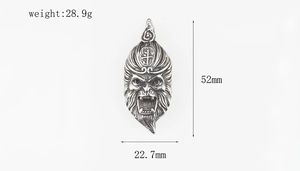 Detailed macro view of vintage silver Sun Wukong pendant with size measurements