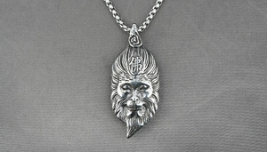 Detailed macro view of vintage silver Sun Wukong pendant with engraved Buddha character