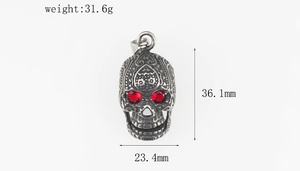 Detailed view of red-eyed skull pendant showing dimensions 36.1mm by 23.4mm