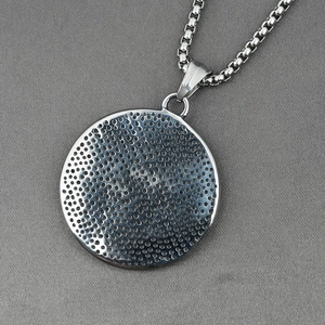 Men's titanium steel necklace featuring a circular perforated griffin animal pendant and box chain