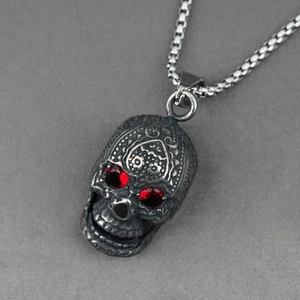 Punk skull pendant necklace with red eye stones and antique silver floral engraving