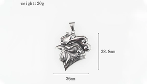 Detail of vintage silver rooster pendant featuring intricate feather textures and carvings