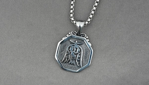 Detailed macro view of an octagonal Bagua pendant on a robust square box chain