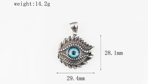Detailed macro of Evil Eye pendant showing dragon scale textures and 28.1mm dimensions