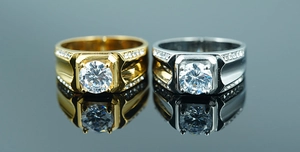 Detailed view of luxury gold and silver rings with large zircon stones and pave set side crystals