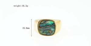 Detailed view of wide gold band ring with abalone shell inlay and dimension marks