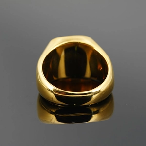 Polished gold wide band stainless steel ring with mirror finish and reflective base