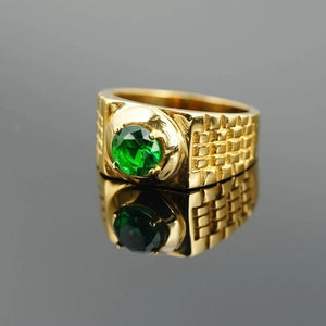 Classic gold titanium ring for men with round green gemstone and textured relief pattern