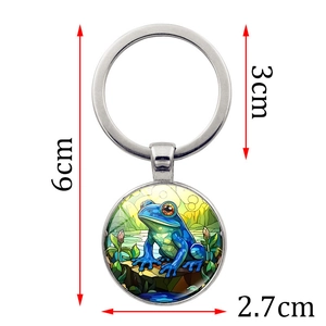 Detailed view of frog prince glass dome keychain with 2.7cm pendant and 6cm total length