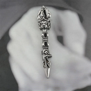 Vintage stainless steel Vajra pestle necklace with detailed religious deity carvings