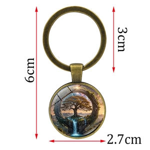Antique bronze Tree of Life keychain with artistic glass pendant and fantasy tree landscape