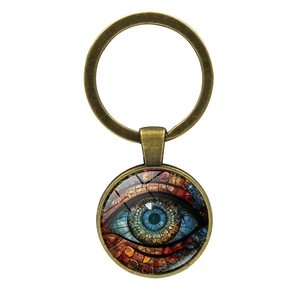 Detailed close-up of Evil Eye mandala keychain with bronze alloy ring on white background