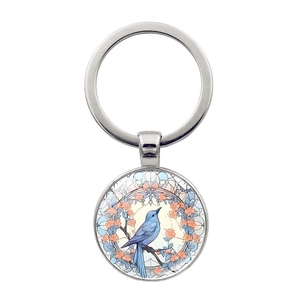 Porte-clés cabochon en verre colibri avec oiseau bleu et fleurs dans un anneau en métal