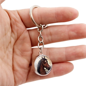 Handheld silver key ring with double-sided crystal glass ball featuring a realistic horse head