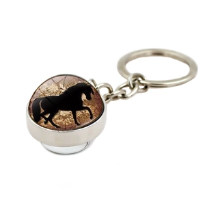 Detailed view of horse silhouette pendant keychain with vintage brown glass dome finish