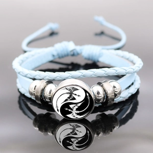 Handmade multilayer leather bracelet featuring Yin Yang twin dragon pendant with adjustable cord