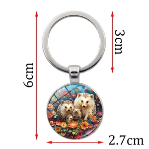 Hedgehog family glass cabochon keychain with colorful floral illustration and metal ring