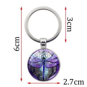 Detailed close-up showing the 6cm vintage dragonfly keychain dimensions and metallic ring