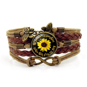 Bohemian multi-layer leather bracelet with sunflower pendant and butterfly charms