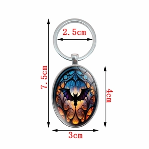Detailed size specifications for oval glass bat pendant keychain with dimensions listed