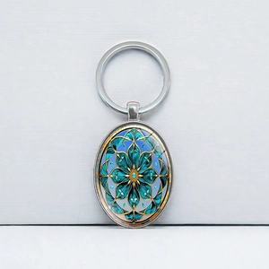 Porte-clés mandala ovale bohème en argent avec dôme en verre bleu et anneau en métal
