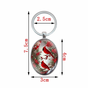 Oval cardinal bird pendant keychain with silver metal ring and holly berry glass cabochon