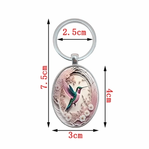 Fashionable oval hummingbird and floral pendant metal keychain accessory total length 7.5cm