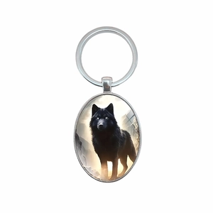 Porte-clés ovale en métal unique avec un motif de loup noir dans la nature sauvage