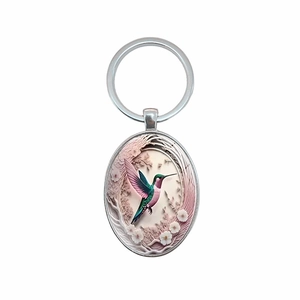 Fashionable hummingbird pattern oval pendant keychain made of polished silver metal