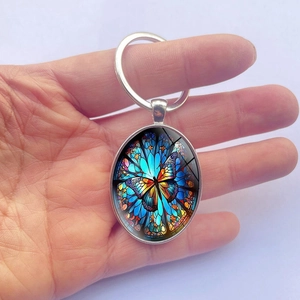 Bunter Schmetterling Glasedelstein Schlüsselanhänger mit silbernem Rahmen und Metallring
